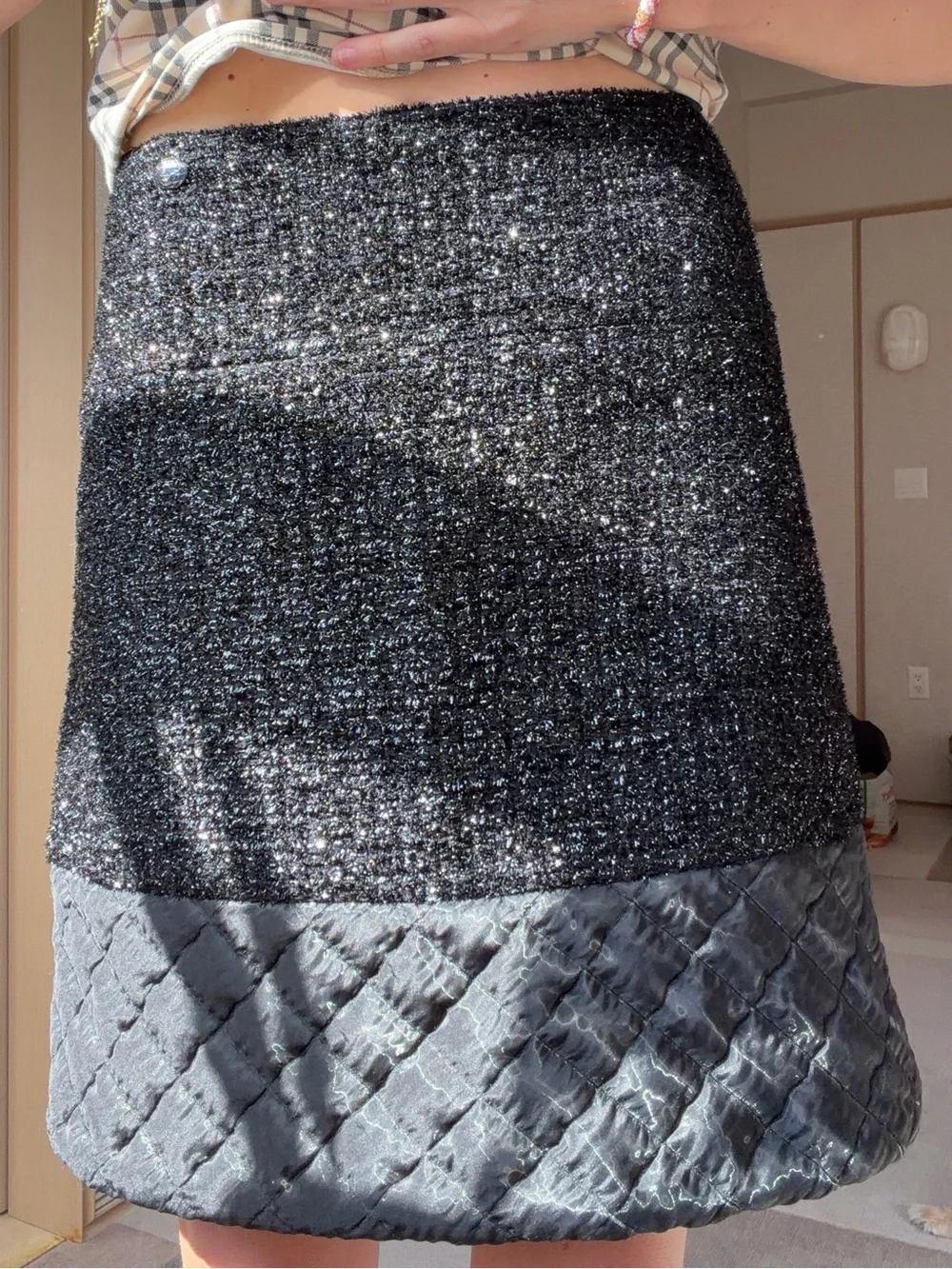 CHANEL Black Sparkle Tweed Mini Skirt with Quilted Hem